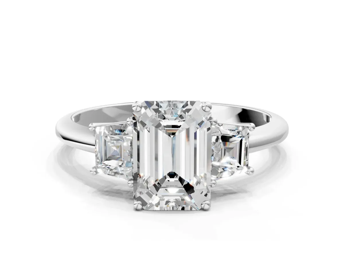 Emerald Cut Diamond Three-Stone Ring with Trapezoid Side Stones and Prong Setting Silver