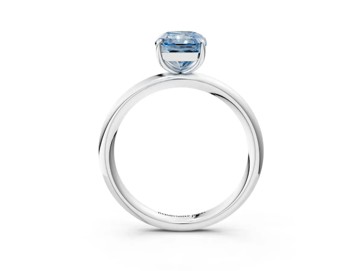 Fancy Blue Radiant Cut Solitaire Diamond Ring with Four-Prong Setting on a Plain Band Platinum
