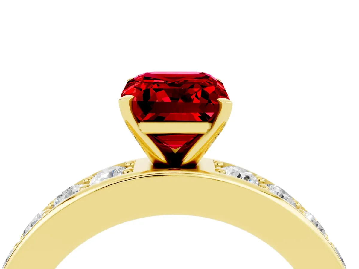 Emerald Cut Ruby Engagement Ring with Channel Set Round Band and Prong Setting Yellow gold