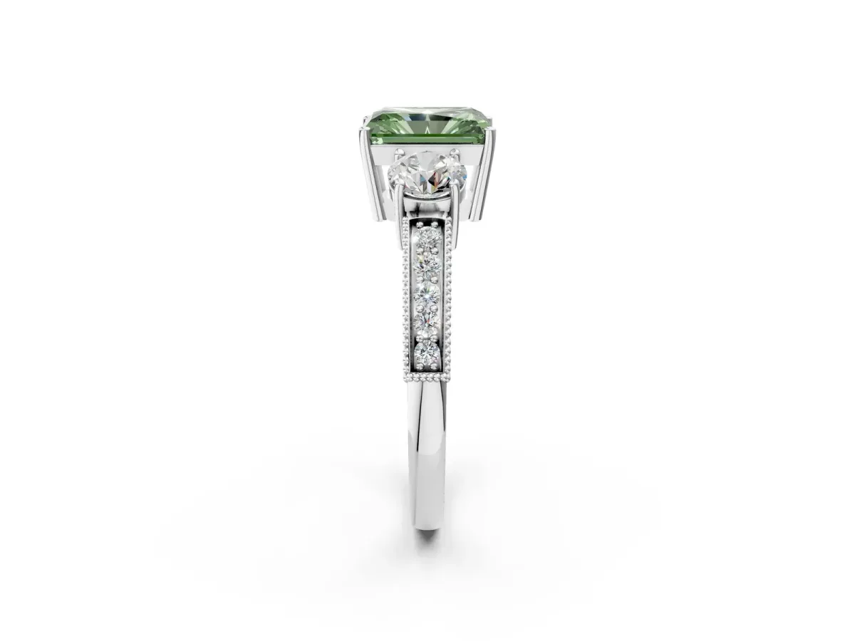 Fancy Green Radiant Cut Three-Stone Diamond Ring with Pavé Band and Four-Prong Setting Platinum
