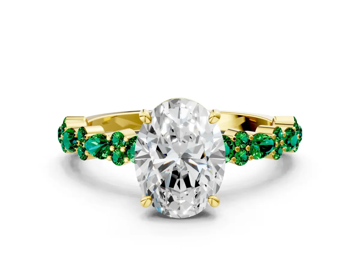 Oval Cut Diamond Side Stone Solitaire Ring with Round Emerald and Four-Prong Setting Yellow gold