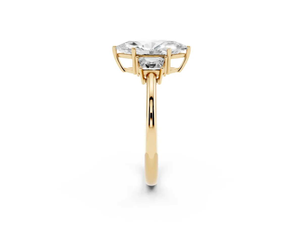 Marquise Cut Diamond Three-Stone Ring with Trapezoid Side Stones and Prong Setting Yellow gold