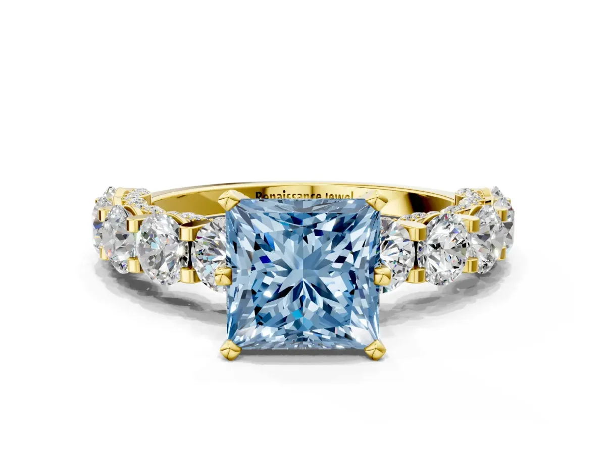 Fancy Blue Princess Cut Diamond Side Stone Engagement Ring with Four-Prong Setting Yellow gold