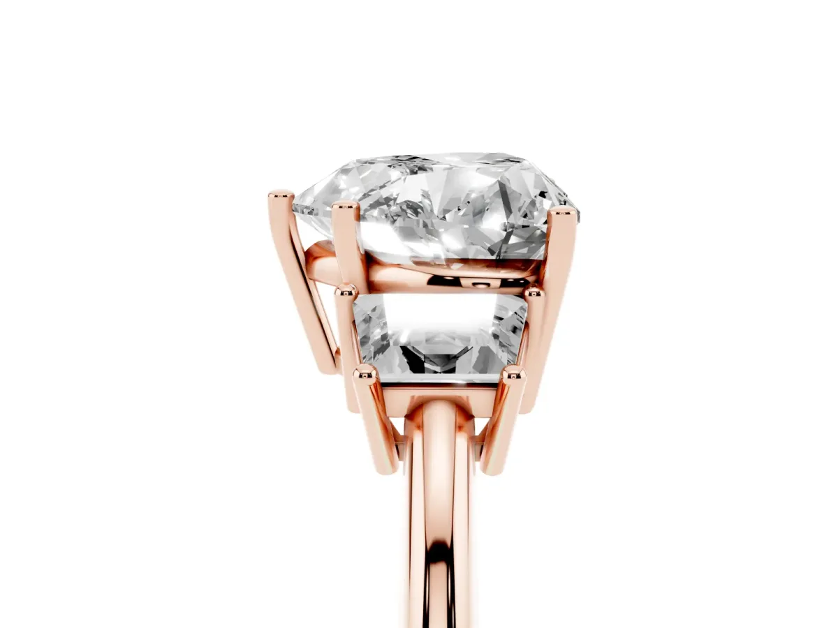 Heart Cut Diamond Three-Stone Ring with Trapezoid Side Stones and Prong Setting Rose gold