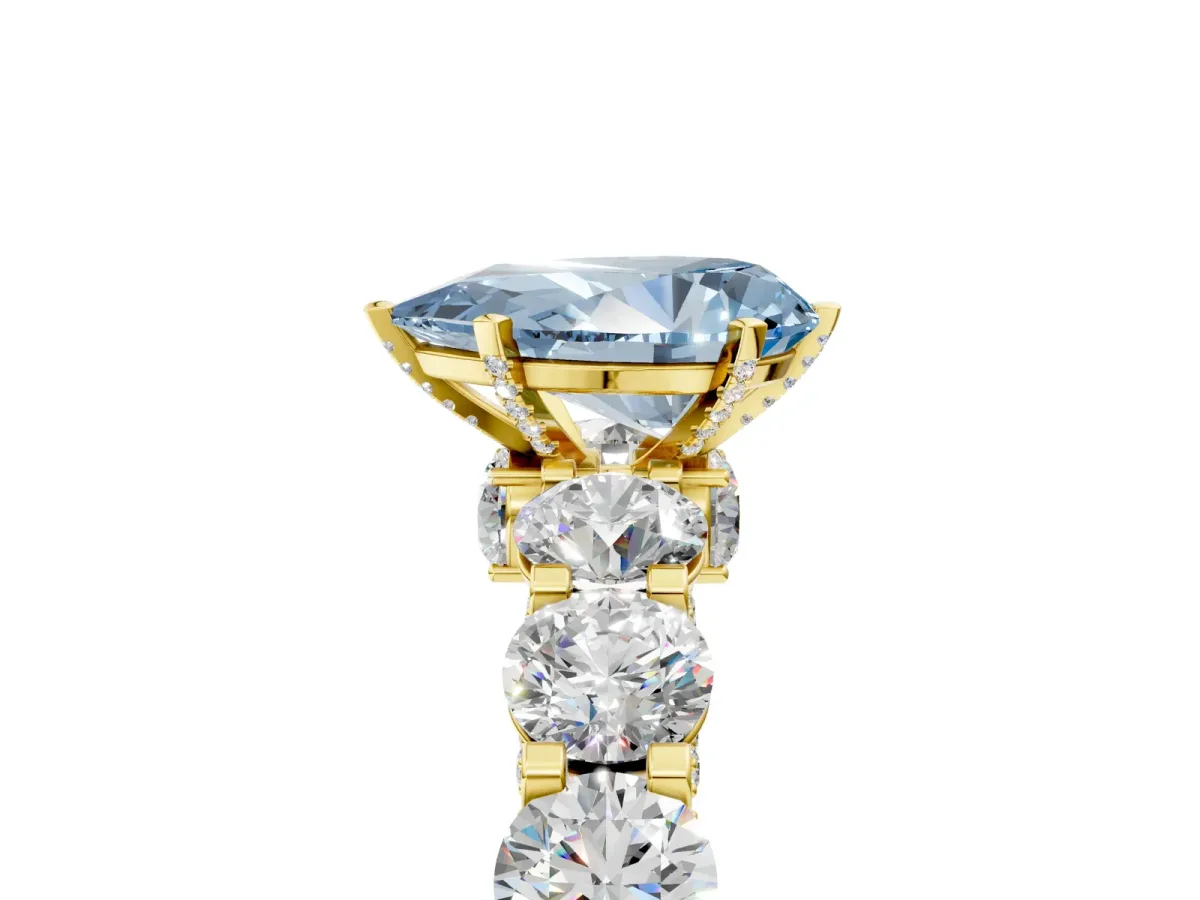 Fancy Blue Pear Cut Diamond Side Stone Engagement Ring with Four-Prong Setting Yellow gold