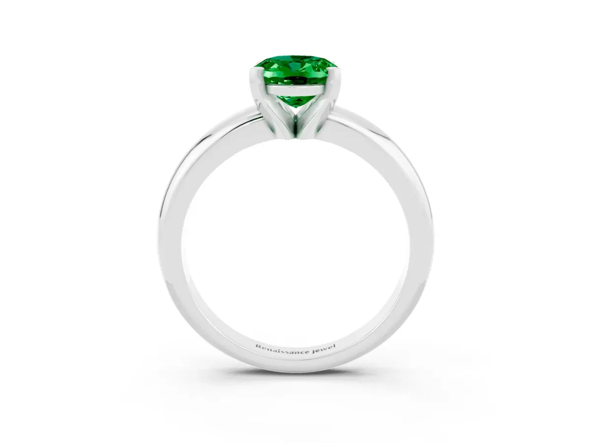 Oval Cut Emerald Solitaire Engagement Ring with Round Band and Four-Prong Setting Silver