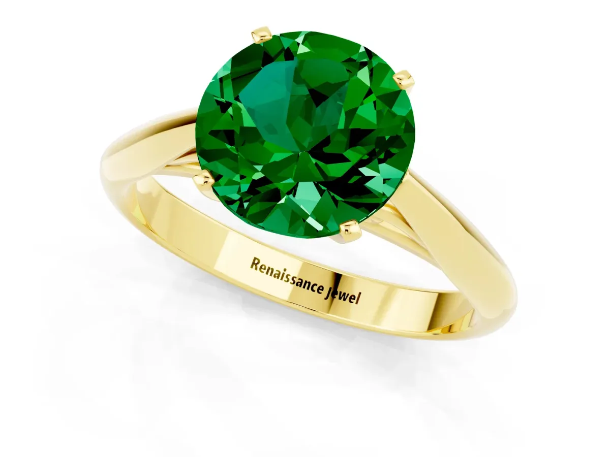 Round Cut Emerald Solitaire Engagement Ring with Cathedral Setting and Four-Prong Mount Yellow gold