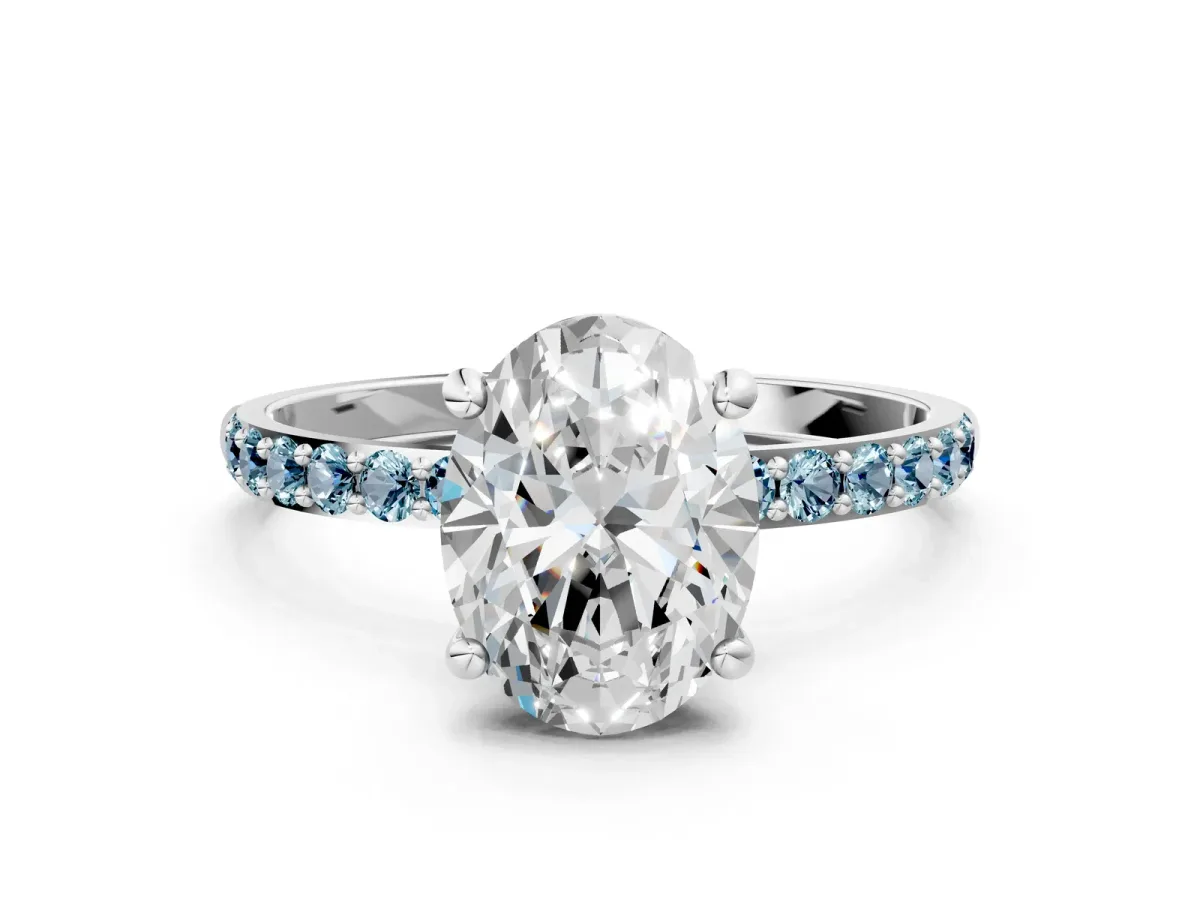 Oval Cut Diamond Solitaire Ring with Round Aquamarine Pavé Band and Prong Setting Silver