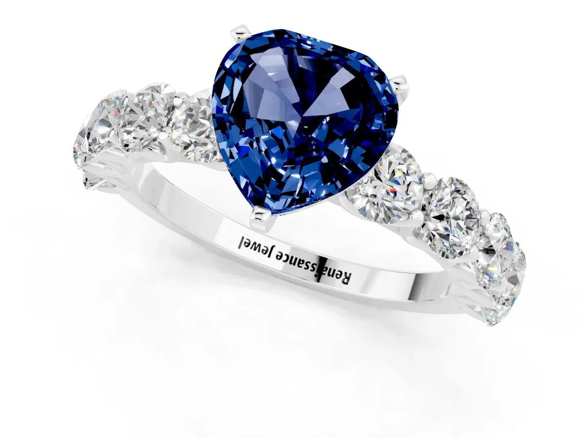 Heart Cut Blue Sapphire Prong Setting with Side Stones on a Pave Band Silver