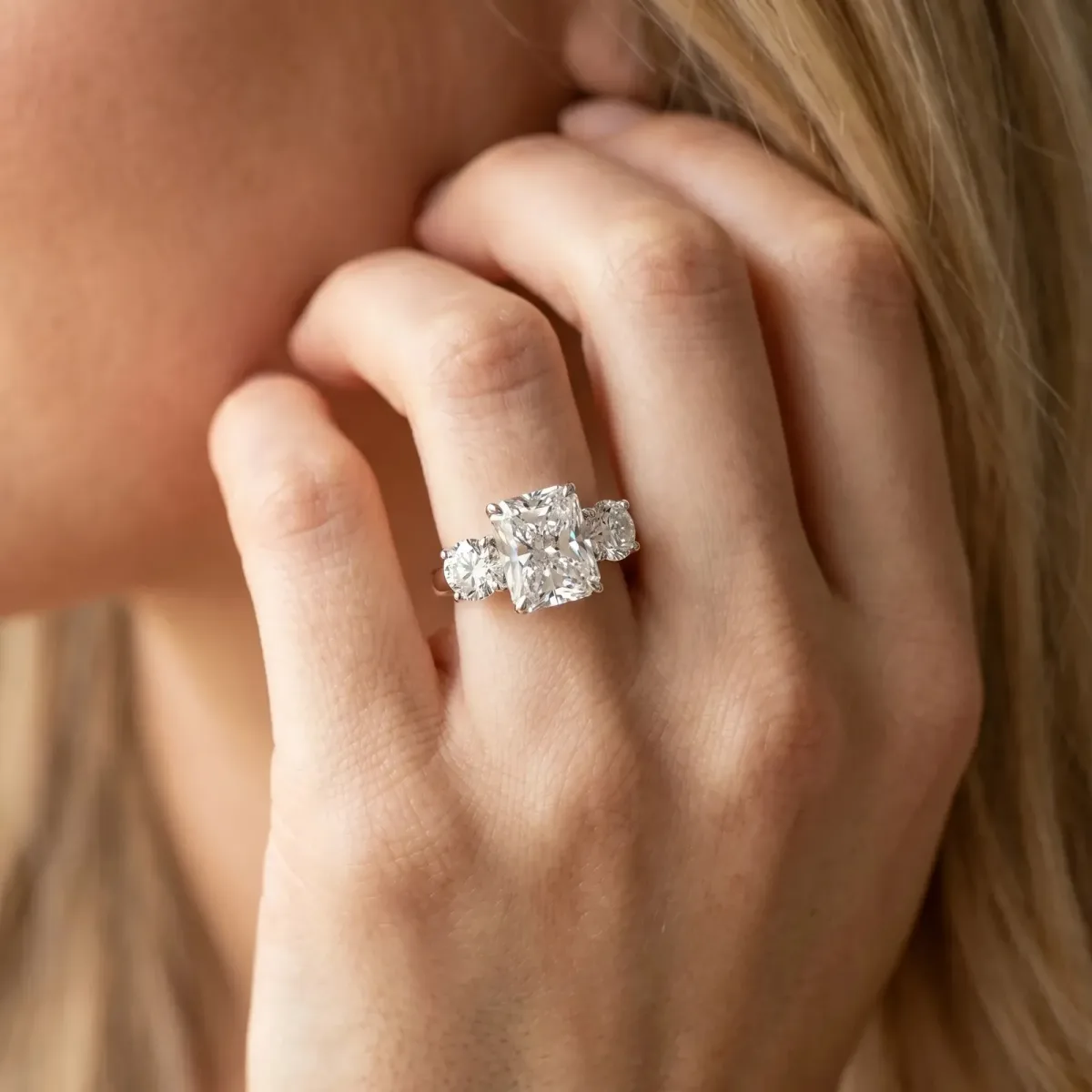 Three-Stone Radiant Cut Cut Diamond Engagement Ring with Prong Setting on a White Gold Band Silver