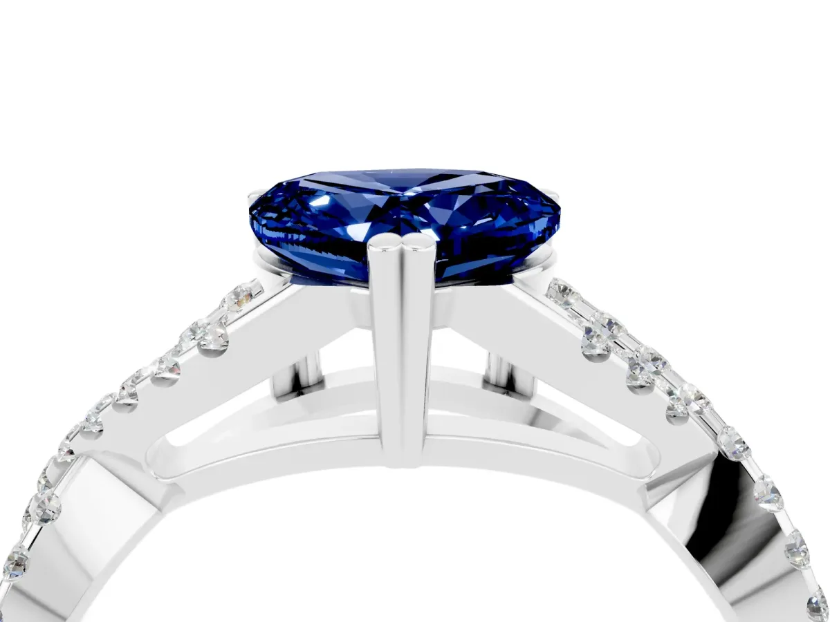 Heart Cut Blue Sapphire Solitaire Ring with Four-Prong Setting and Twisted Pavé Band Silver