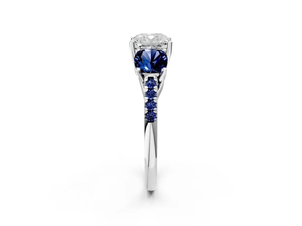 Three-Stone Cushion Cut Diamond Ring with Round Blue Sapphire Pavé Band and Prong Setting Silver