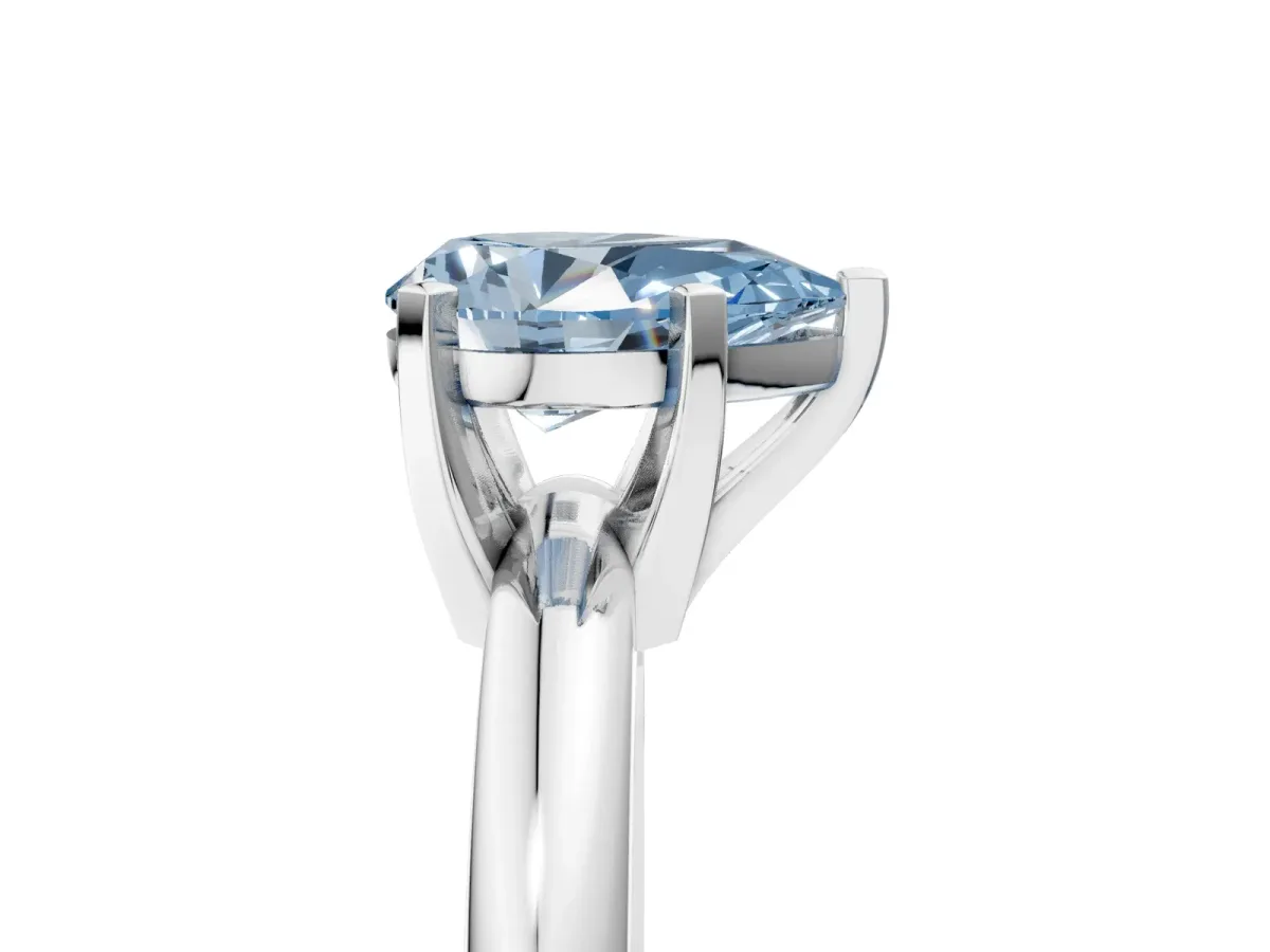 Fancy Blue Pear Cut Diamond Solitaire Engagement Ring with Round Band and Four-Prong Setting Silver