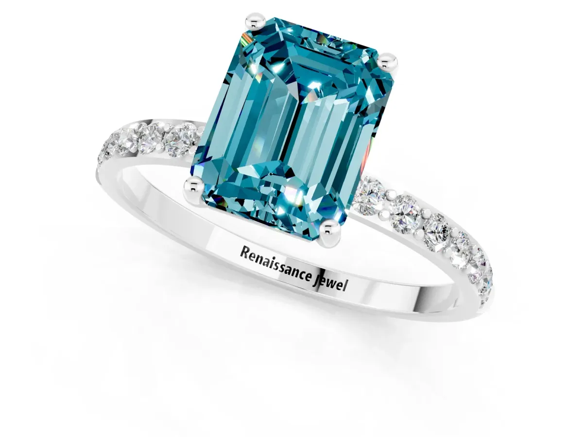 Emerald Cut Blue Topaz Solitaire Ring with Round Pavé Band and Prong Setting Platinum