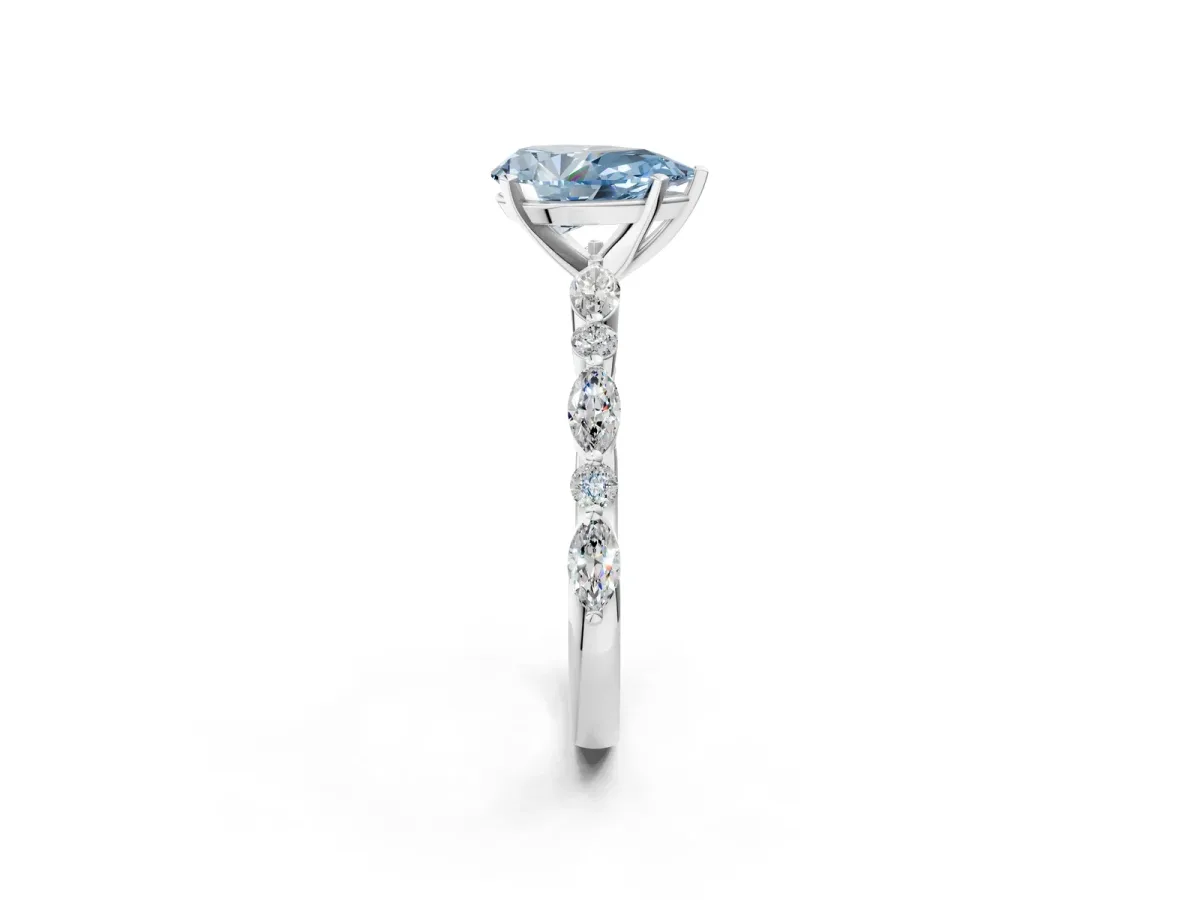 Fancy Blue Pear Cut Diamond Ring with Marquise and Round Side Stones and Four-Prong Setting Silver
