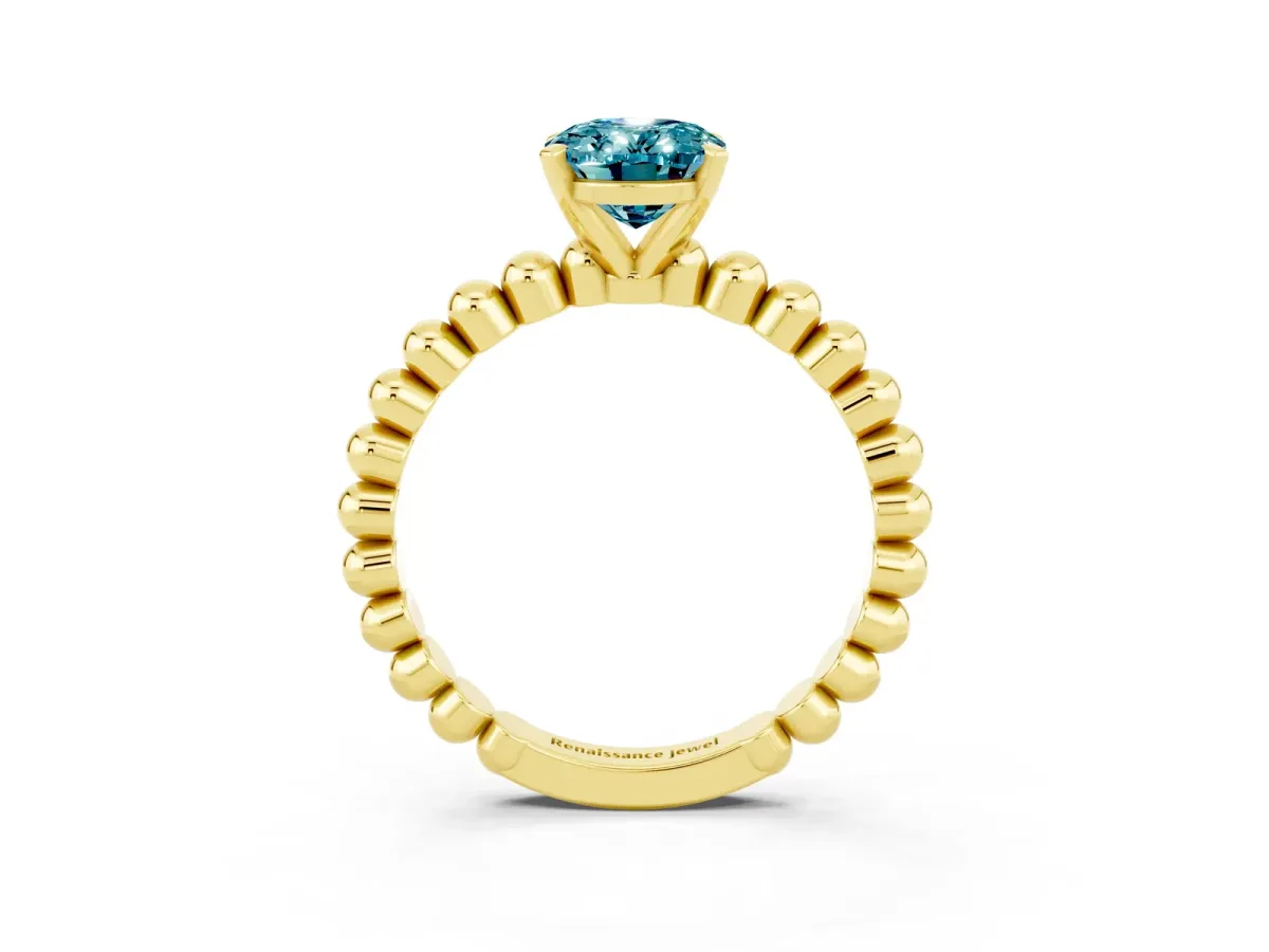 Oval Cut Blue Topaz Solitaire Ring with Beaded Band and Prong Setting Yellow gold