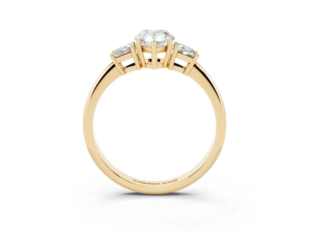 Pear Cut Diamond Three-Stone Ring with Trapezoid Side Stones and Prong Setting Yellow gold