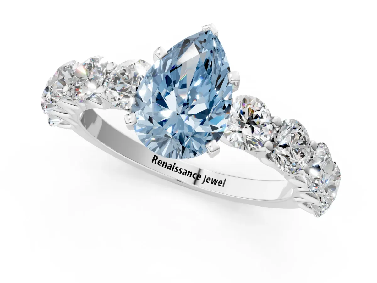 Fancy Blue Pear Cut Diamond Prong Setting with Side Stones on a Pave Band Silver
