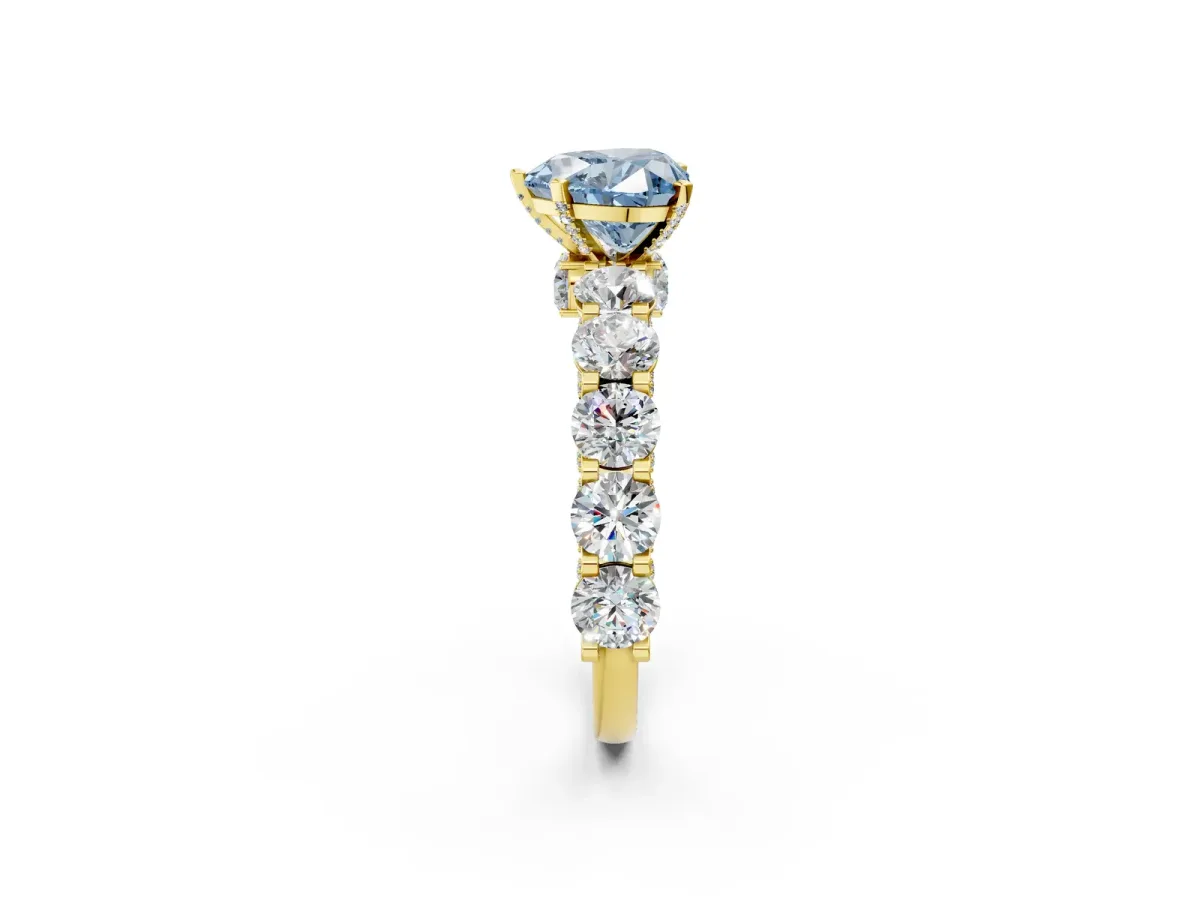 Fancy Blue Heart Cut Diamond Side Stone Engagement Ring with Four-Prong Setting Yellow gold