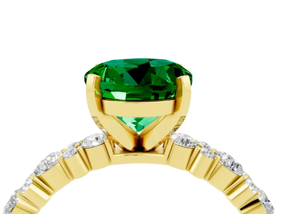 Round Cut Emerald Side Stone Solitaire Ring with Round and Four-Prong Setting Yellow gold