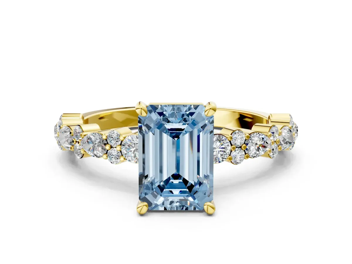 Fancy Blue Emerald Cut Diamond Side Stone Solitaire Ring with Round and Four-Prong Setting Yellow gold
