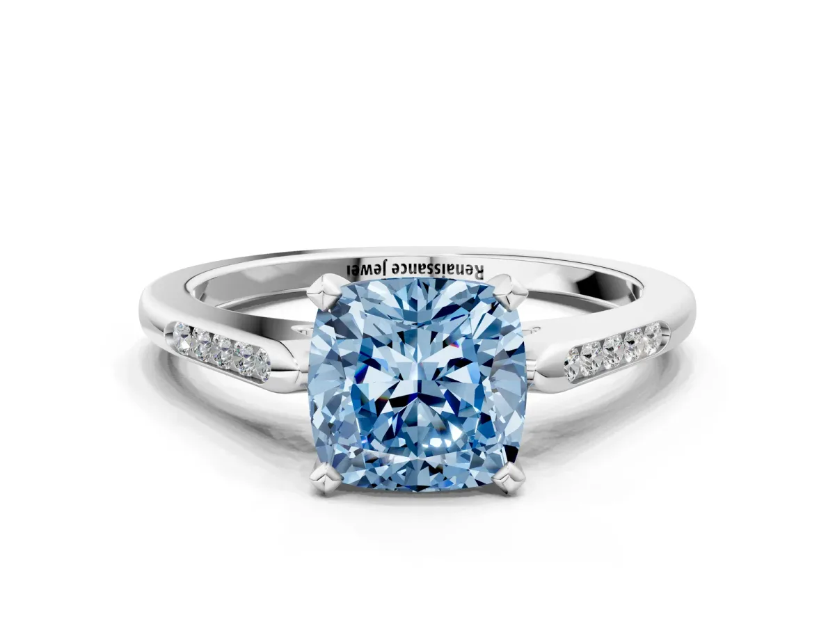 Fancy Blue Cushion Cut Diamond Solitaire Ring with Channel Set Round Band and Prong Setting Silver