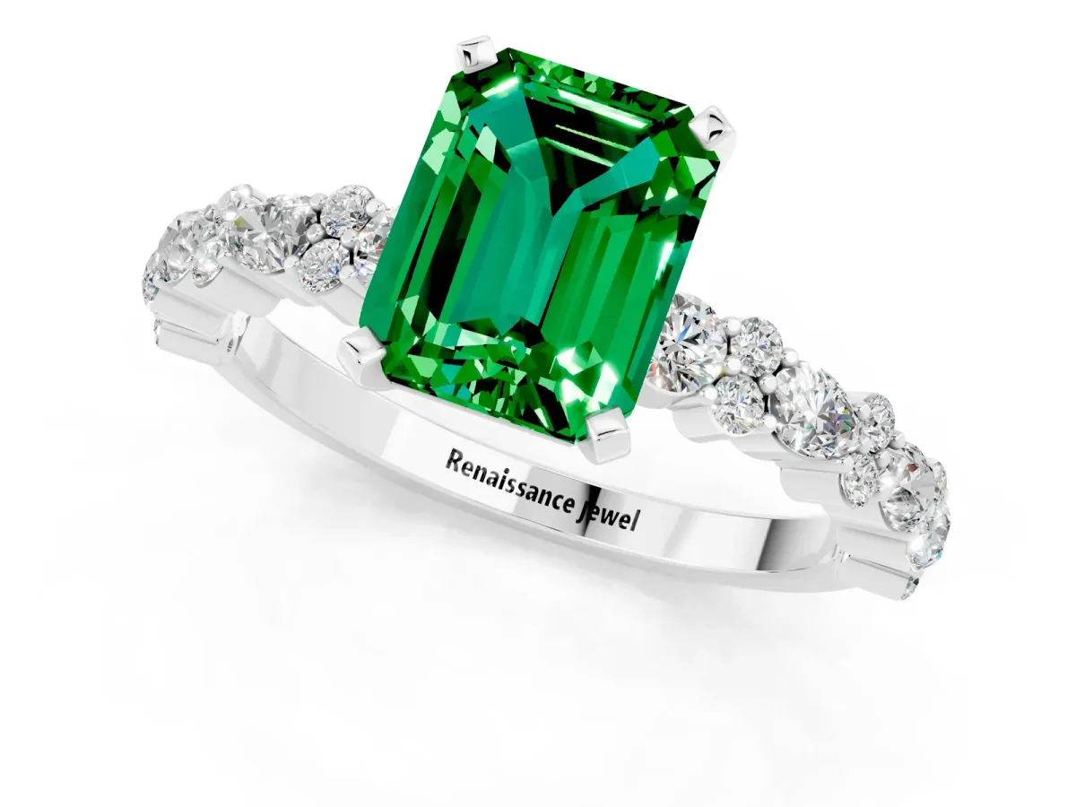 Emerald Cut Emerald Side Stone Solitaire Ring with Round and Four-Prong Setting White gold