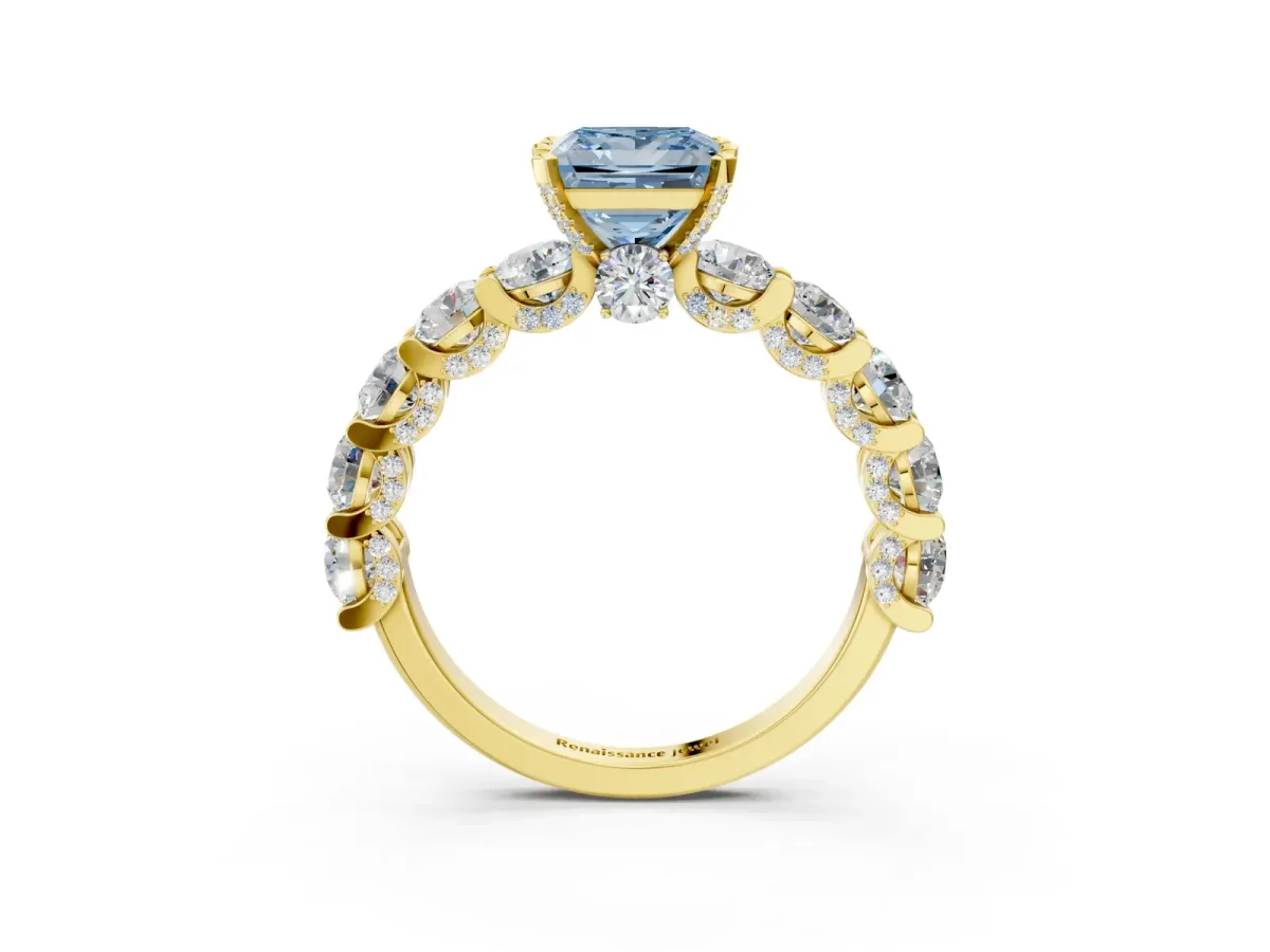 Fancy Blue Princess Cut Diamond Side Stone Engagement Ring with Four-Prong Setting Yellow gold