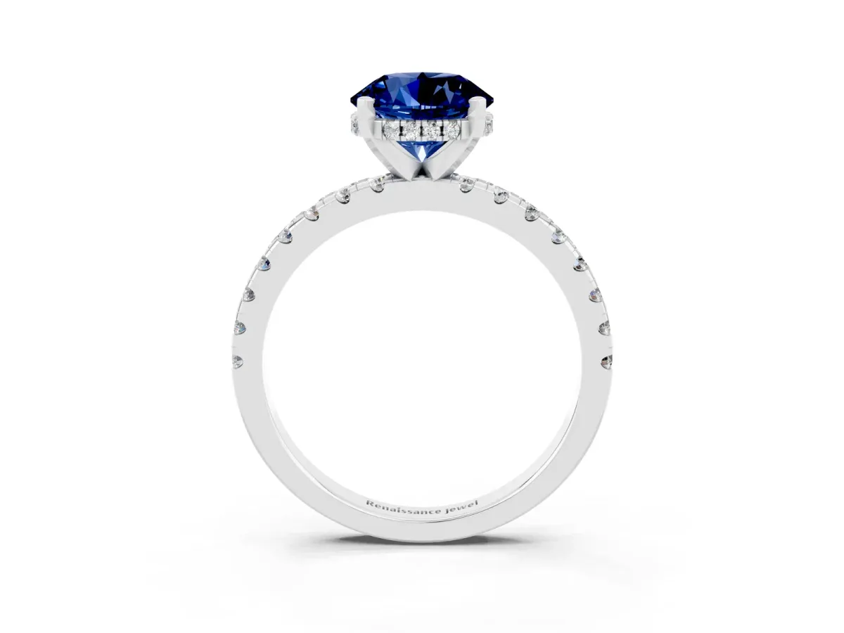 Round Cut Blue Sapphire Solitaire Ring with Round Pavé Band and Four-Prong Setting Silver