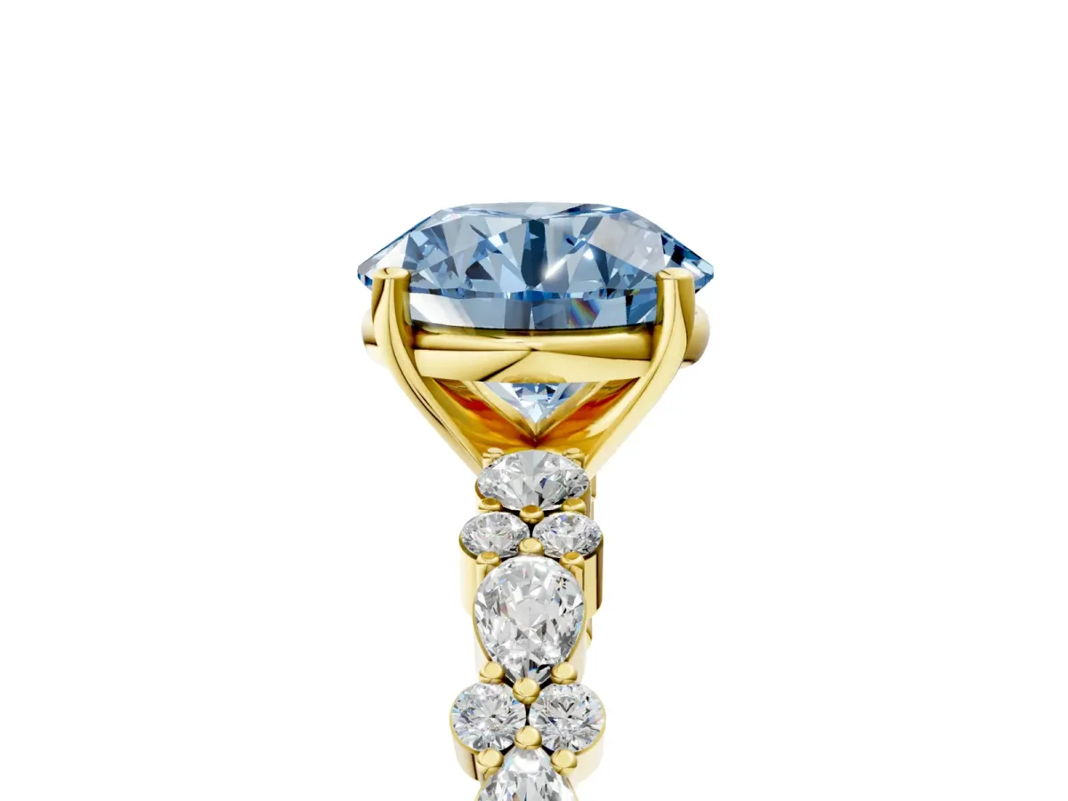 Fancy Blue Round Cut Diamond Side Stone Solitaire Ring with Round and Four-Prong Setting Yellow gold