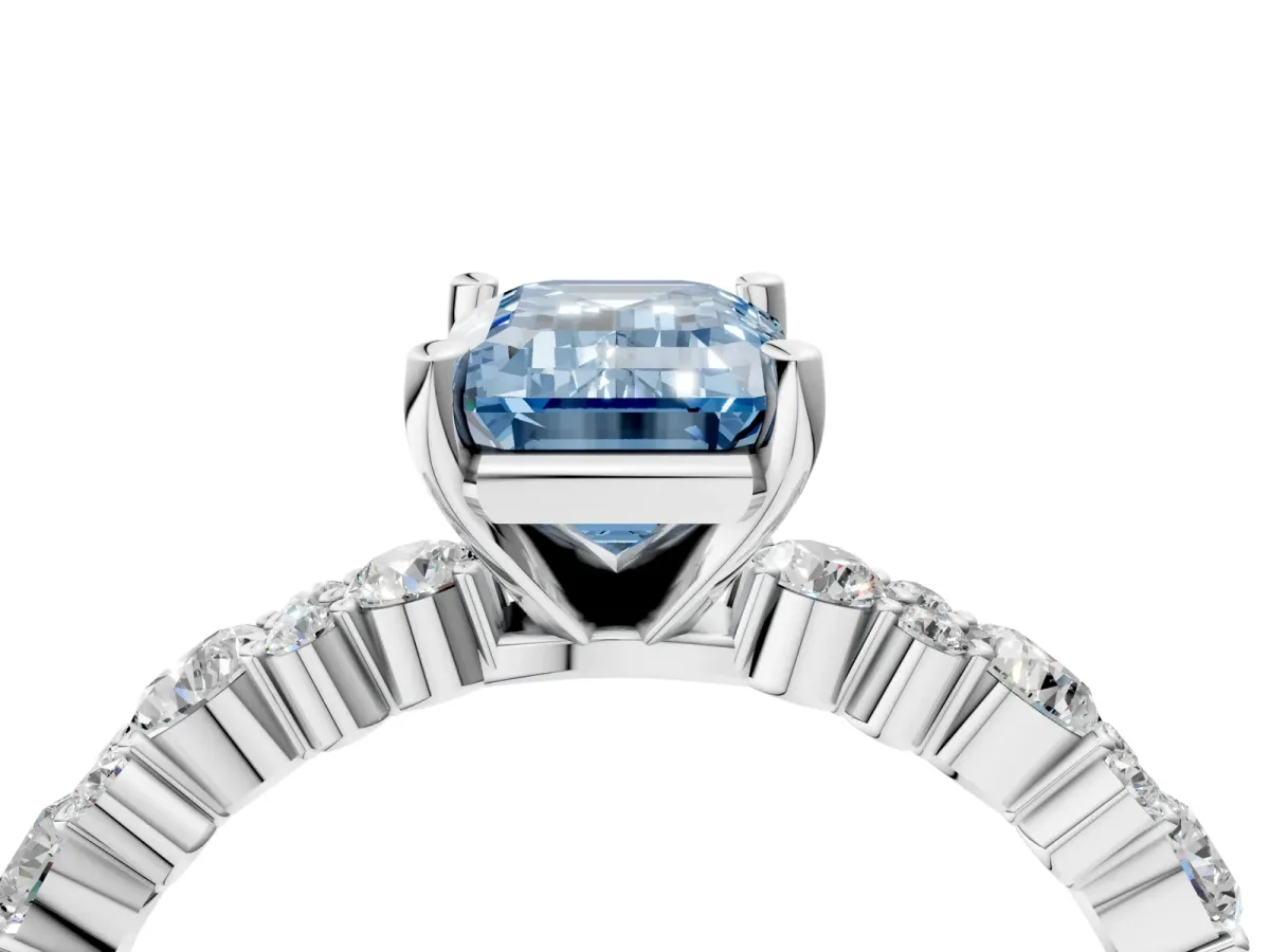 Fancy Blue Emerald Cut Diamond Side Stone Solitaire Ring with Round and Four-Prong Setting Platinum