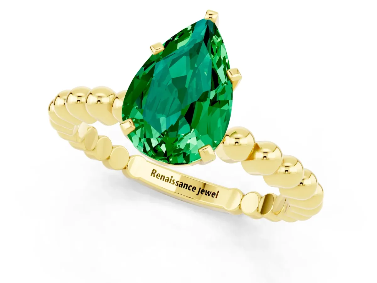 Pear Cut Emerald Solitaire Ring with Beaded Band and Prong Setting Yellow gold