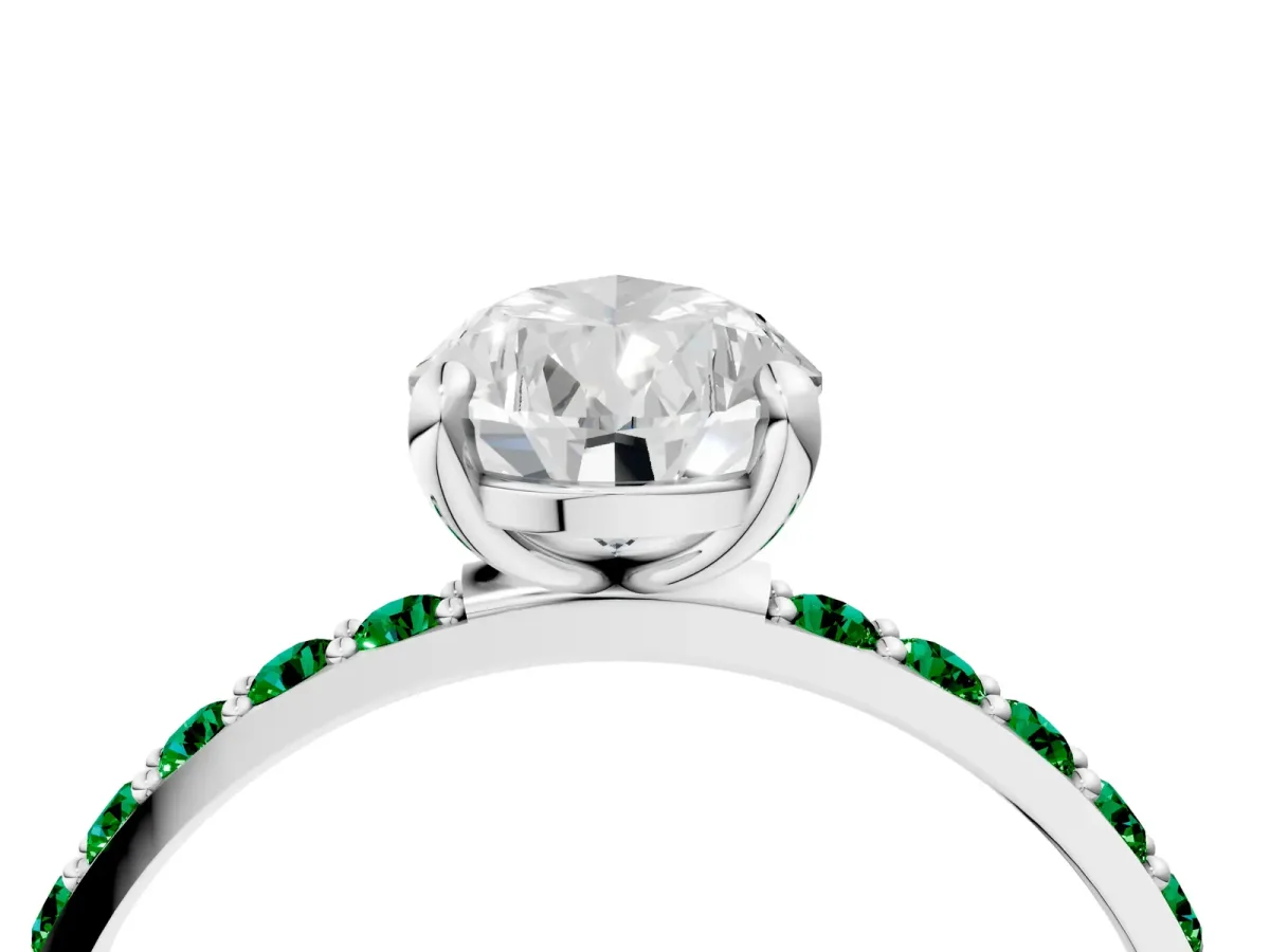 Pear Cut Diamond Solitaire Ring with Round Emerald Pavé Band and Prong Setting Silver