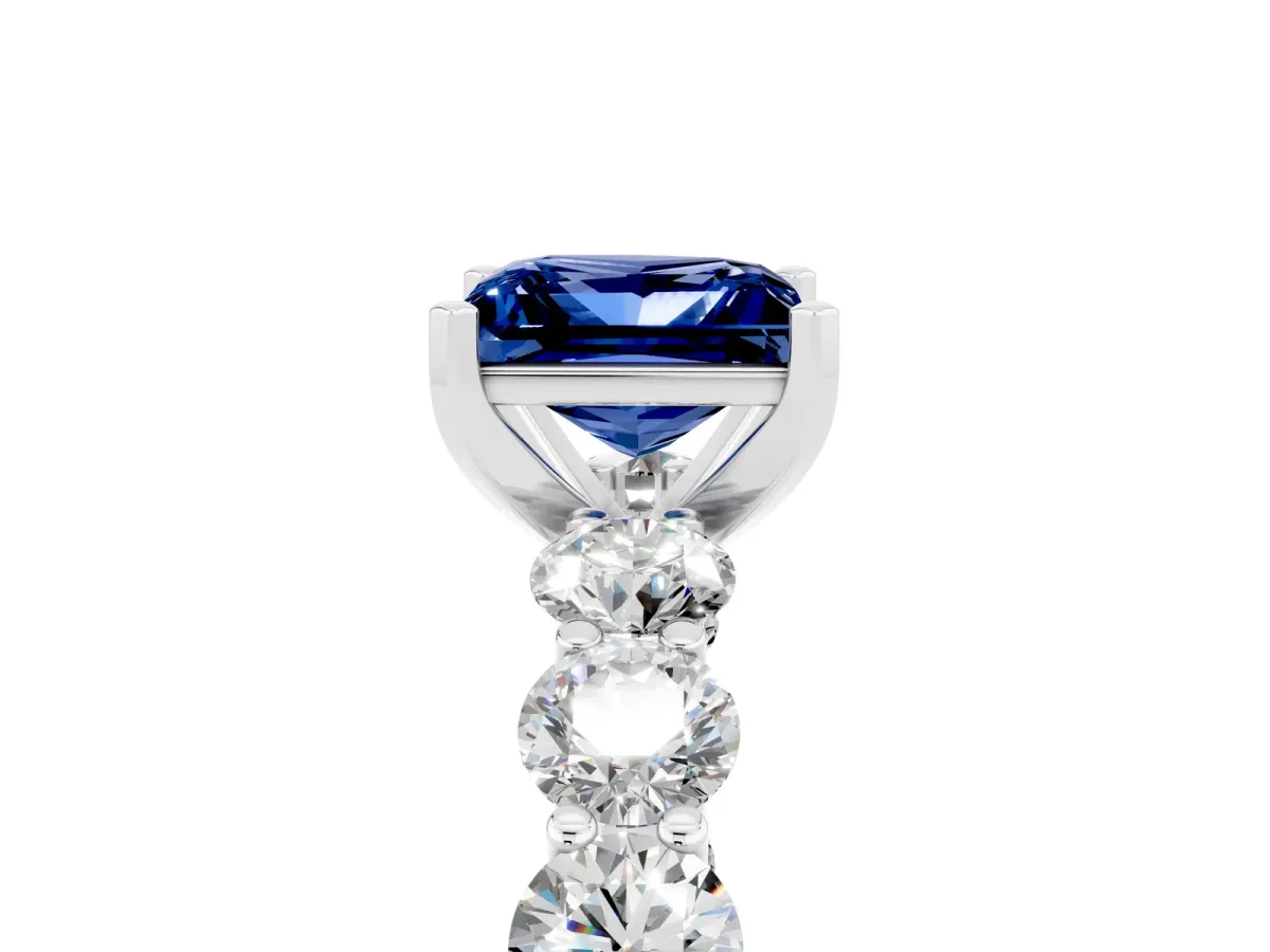 Princess Cut Blue Sapphire Prong Setting with Side Stones on a Pave Band Silver