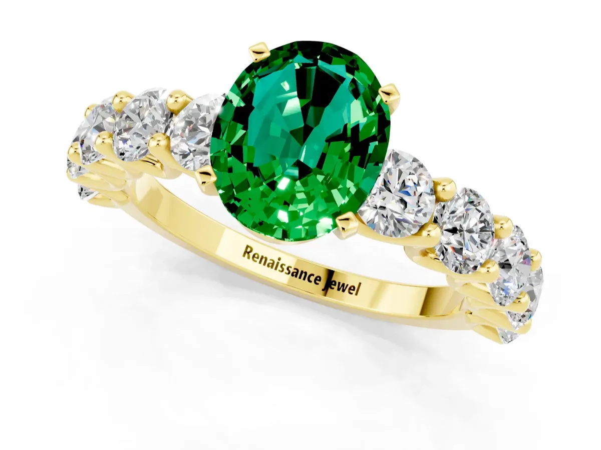 Oval Cut Emerald Prong Setting with Side Stones on a Pave Band Yellow gold