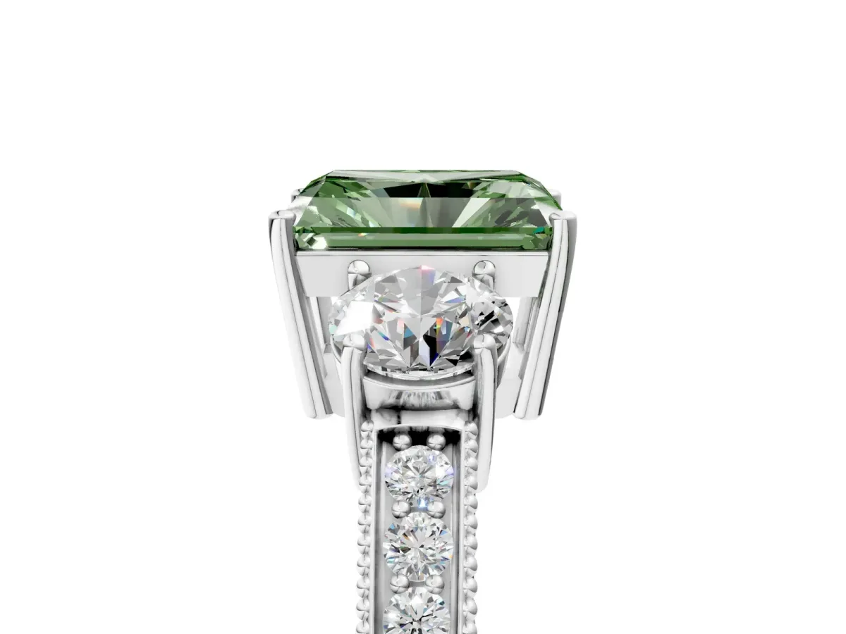 Fancy Green Radiant Cut Three-Stone Diamond Ring with Pavé Band and Four-Prong Setting Platinum
