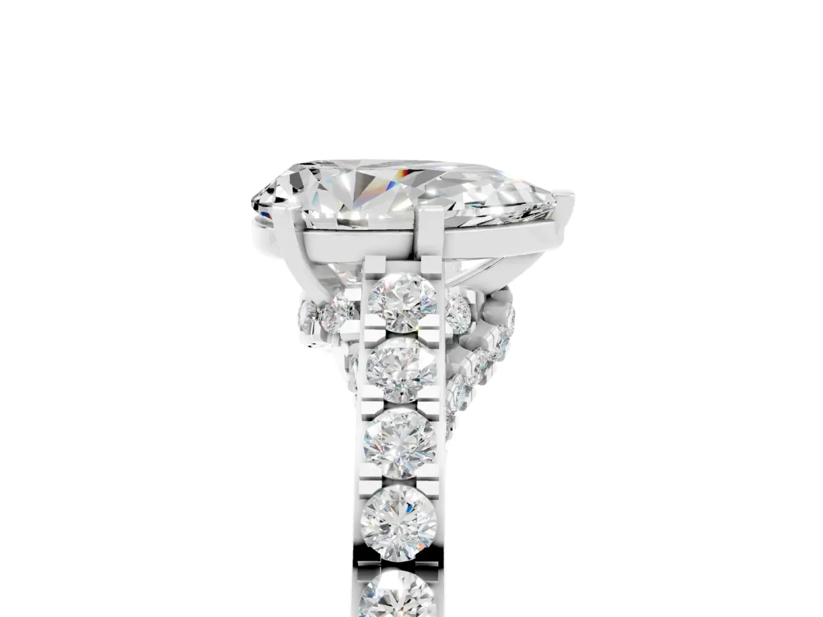 Pear Cut Moissanite Solitaire Ring with Crossover Gallery and Round Pavé Band Silver
