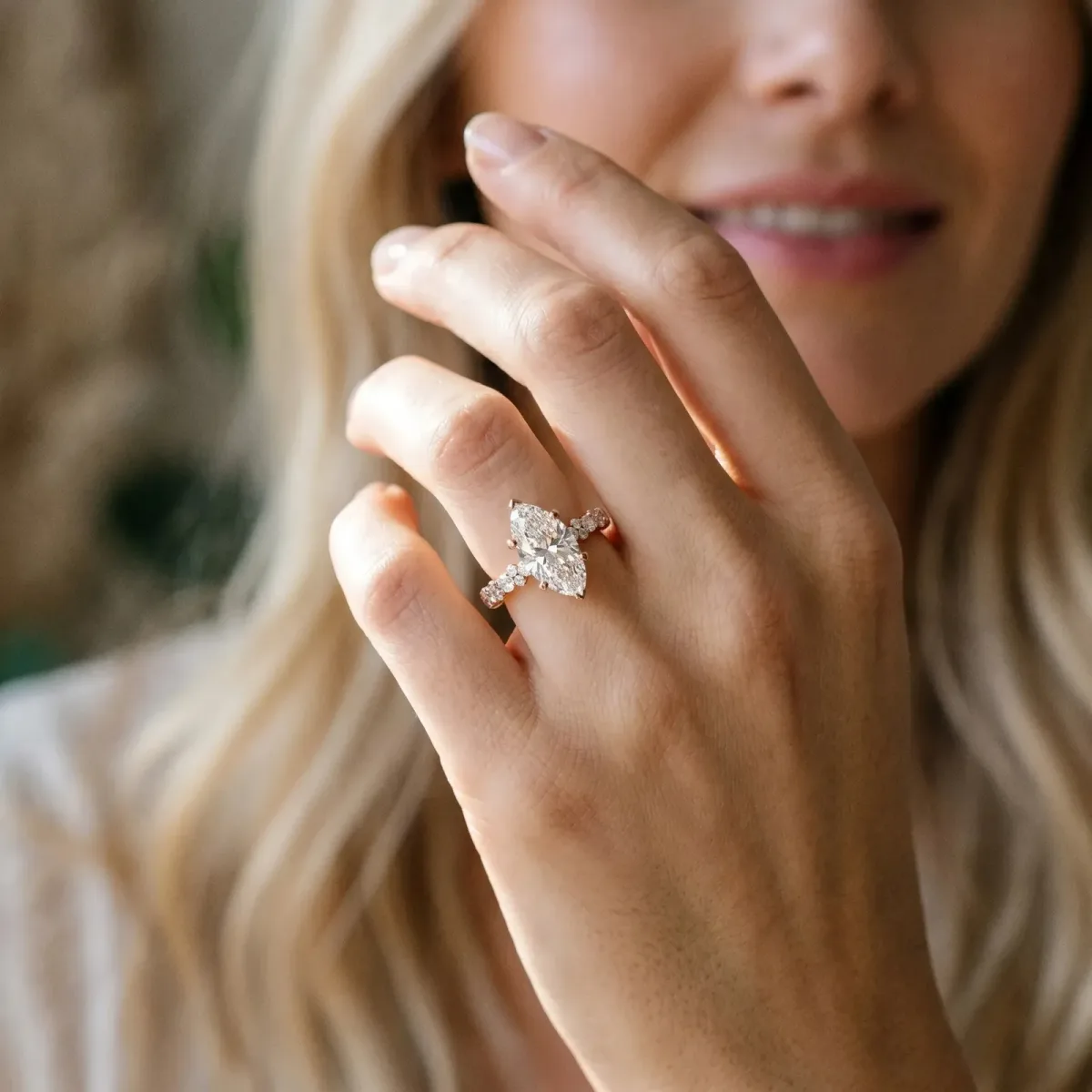 Marquise Cut Diamond Side Stone Solitaire Ring with Round and Four-Prong Setting Rose gold