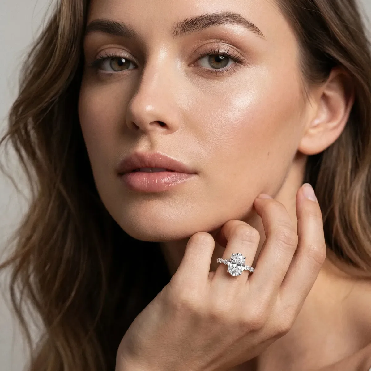 Oval Cut Diamond Ring with Marquise and Round Side Stones and Four-Prong Setting Silver