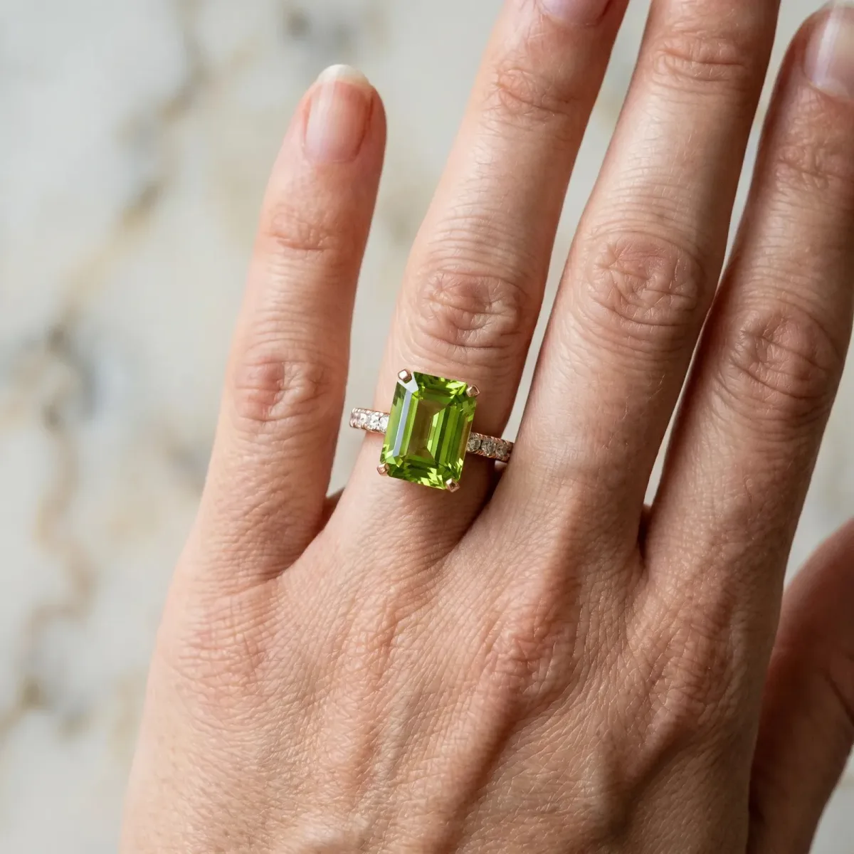 Emerald Cut Peridot Solitaire Ring with Round Pavé Band and Four-Prong Setting Rose gold