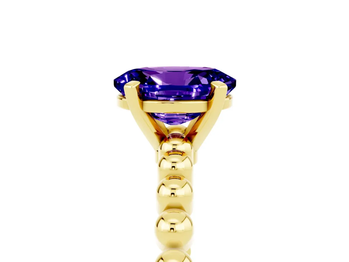 Oval Cut Tanzanite Solitaire Ring with Beaded Band and Prong Setting Yellow gold
