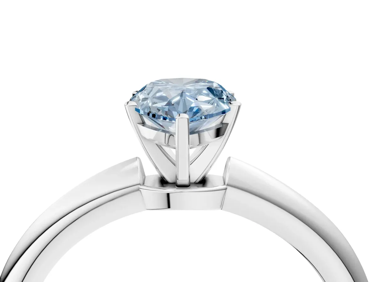 Fancy Blue Pear Cut Diamond Solitaire Ring with Six-Prong Setting and Classic Band Silver