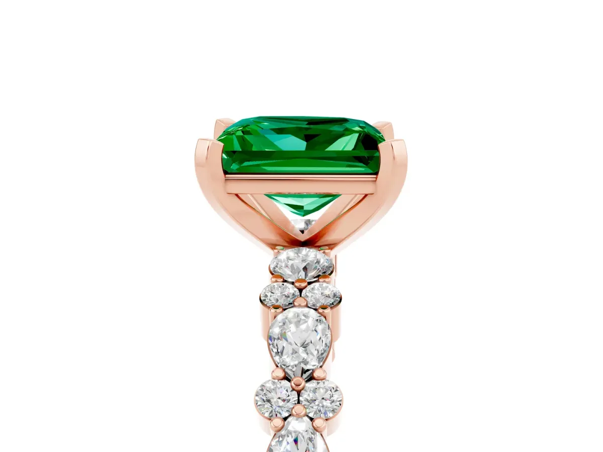 Princess Cut Emerald Side Stone Solitaire Ring with Round and Four-Prong Setting Rose gold