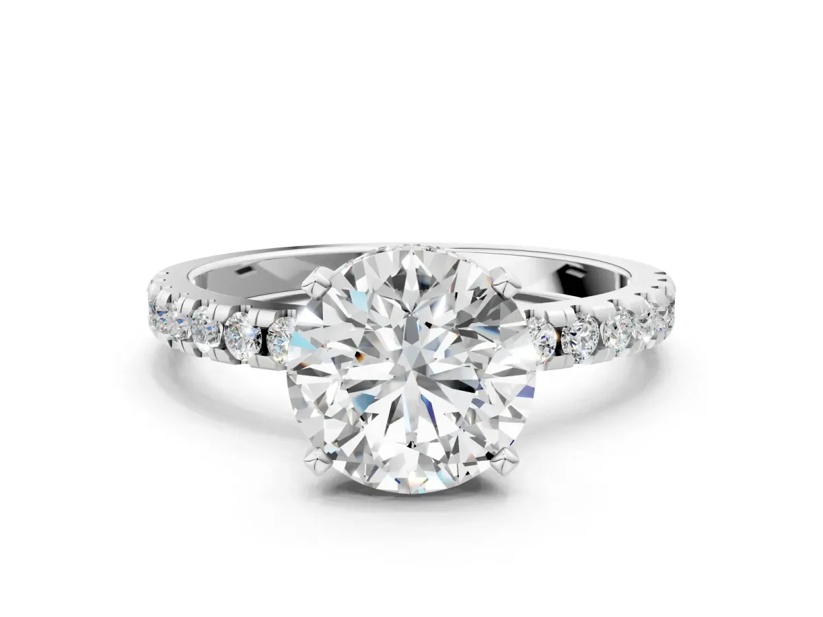 Round Cut Diamond Solitaire Ring with Round Moissanite Pavé Band and Four-Prong Setting Silver