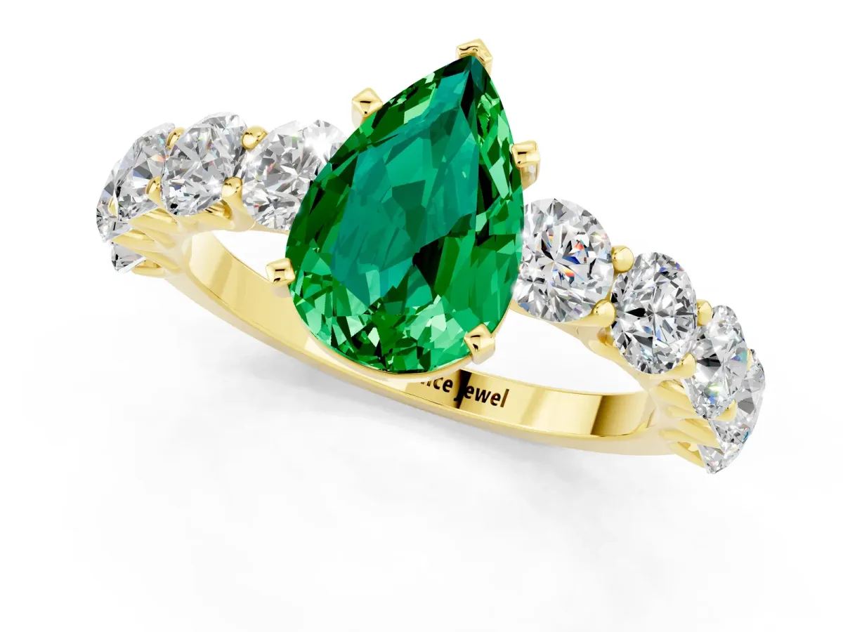 Pear Cut Emerald Prong Setting with Side Stones on a Pave Band Yellow gold