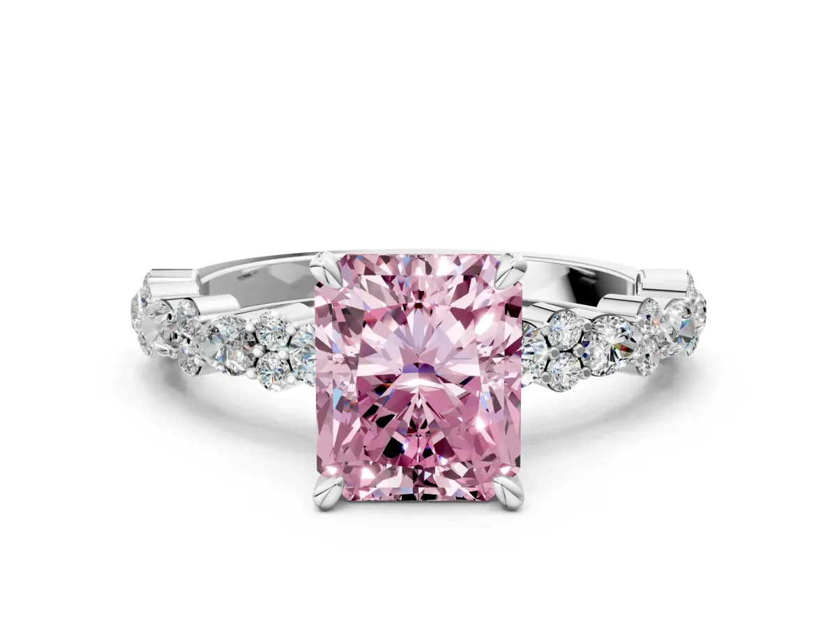 Fancy Pink Radiant Cut Diamond Side Stone Solitaire Ring with Round and Four-Prong Setting Platinum