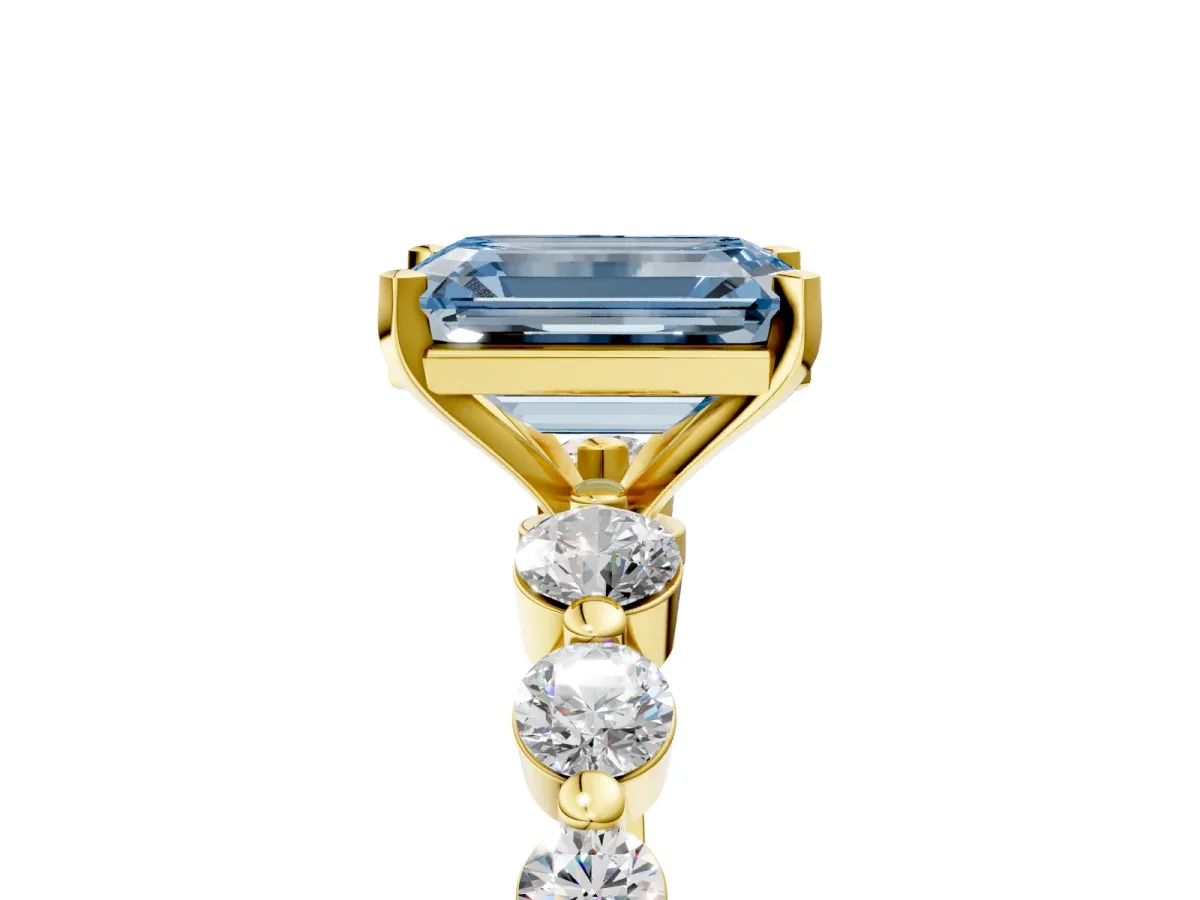 Fancy Blue Emerald Cut Solitaire Diamond Ring with Pave Band and Four-Prong Setting Yellow gold