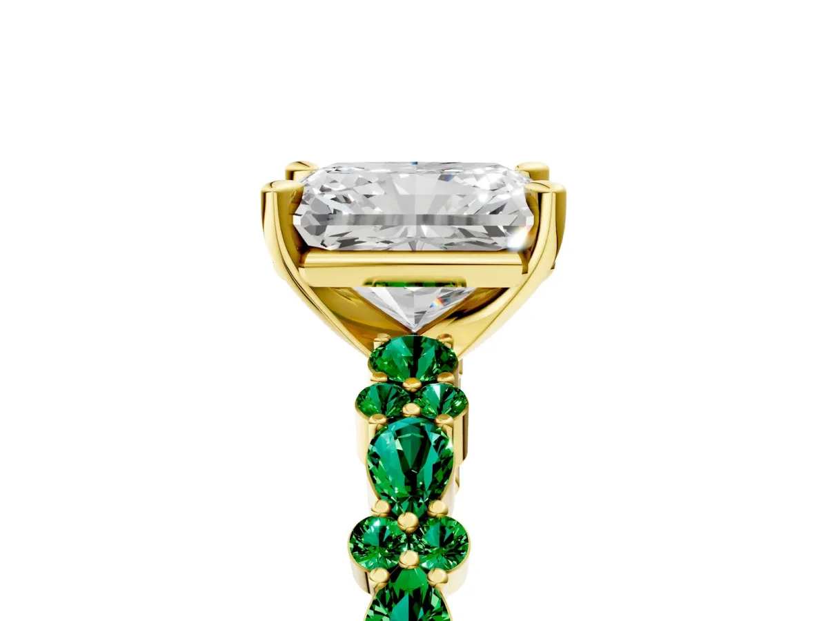 Radiant Cut Diamond Side Stone Solitaire Ring with Round Emerald and Four-Prong Setting Yellow gold