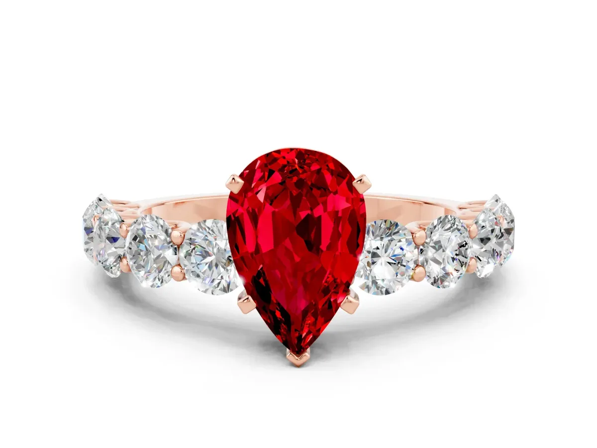 Pear Cut Ruby Prong Setting with Side Stones on a Pave Band Rose gold