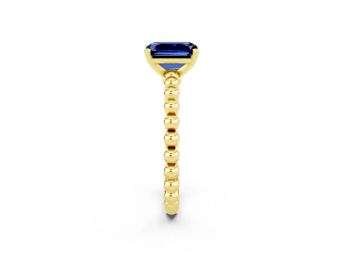 Emerald Cut Blue Sapphire Solitaire Ring with Beaded Band and Prong Setting Yellow gold